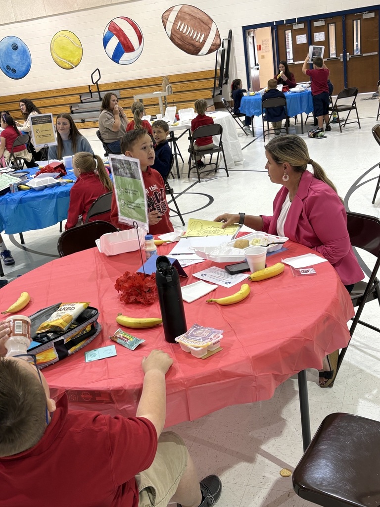 Student sharing LIM Binder with a community leader.