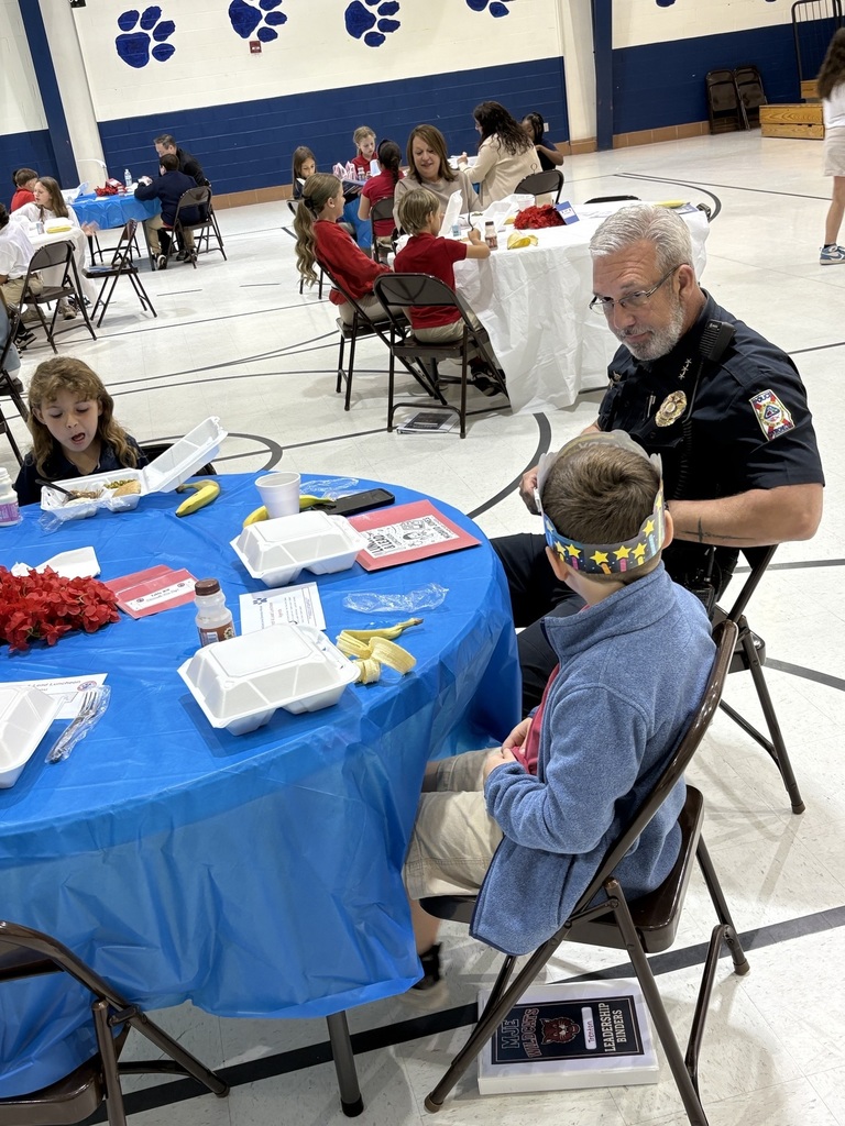 Student sharing LIM Binder with a community leader.