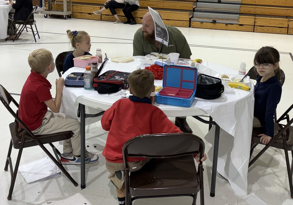 Student sharing LIM Binder with a community leader.