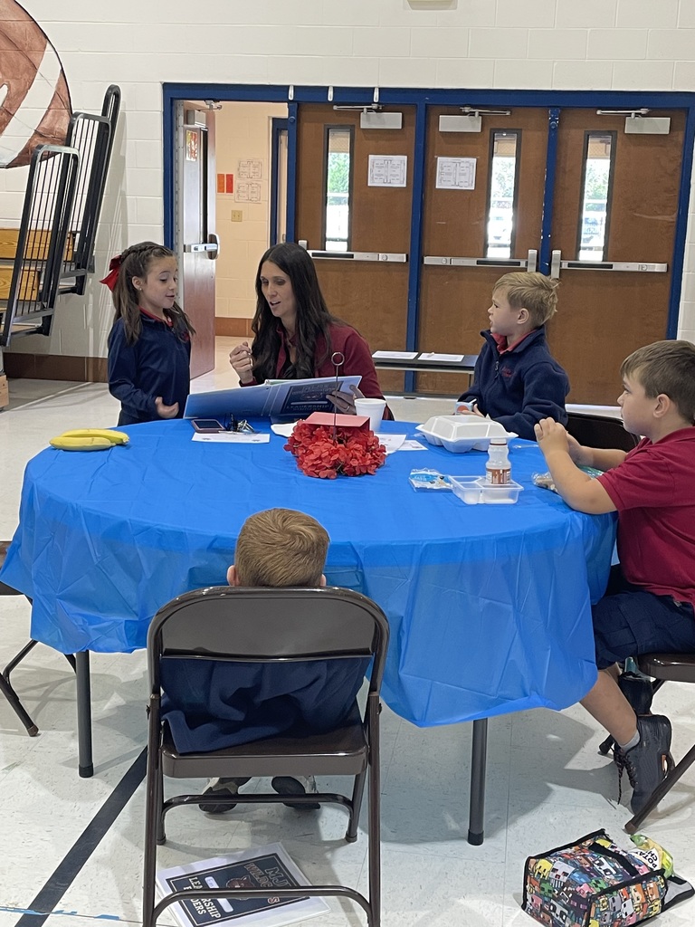 Student sharing LIM Binder with a community leader.