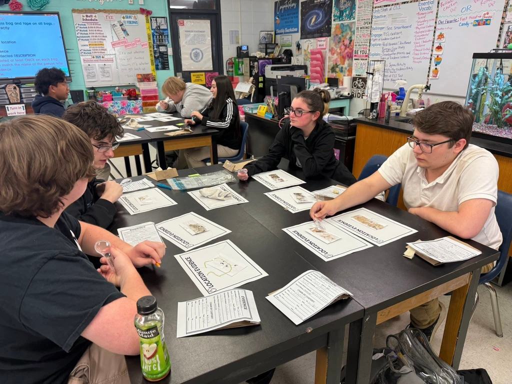 Forensic Science students investigating the case.