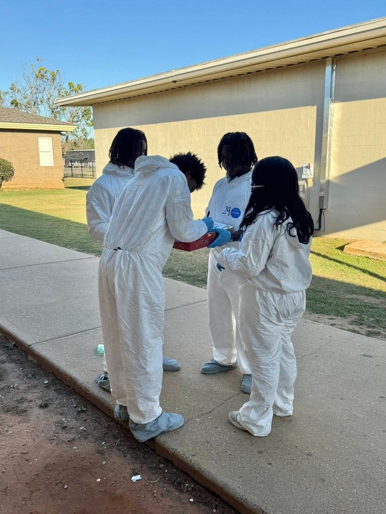 Forensic Science students investigating the case.