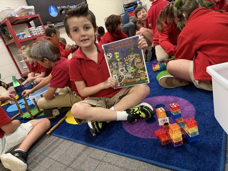 students building a house with legos