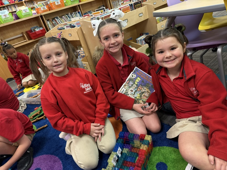 students building a house with legos
