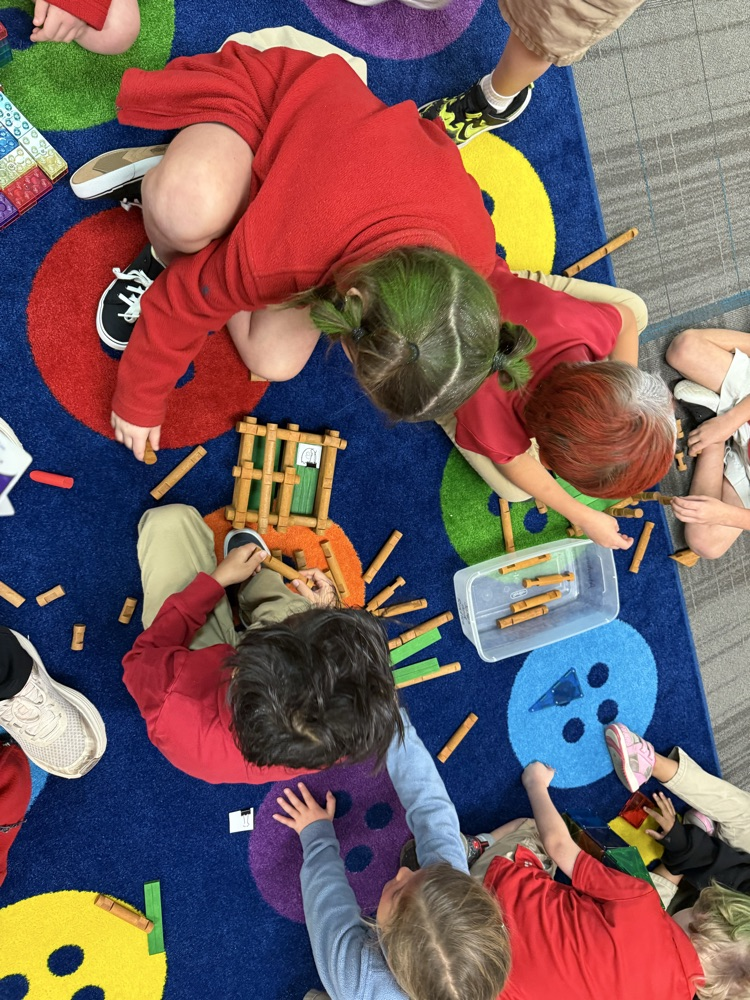 students building a house with Lincoln logs