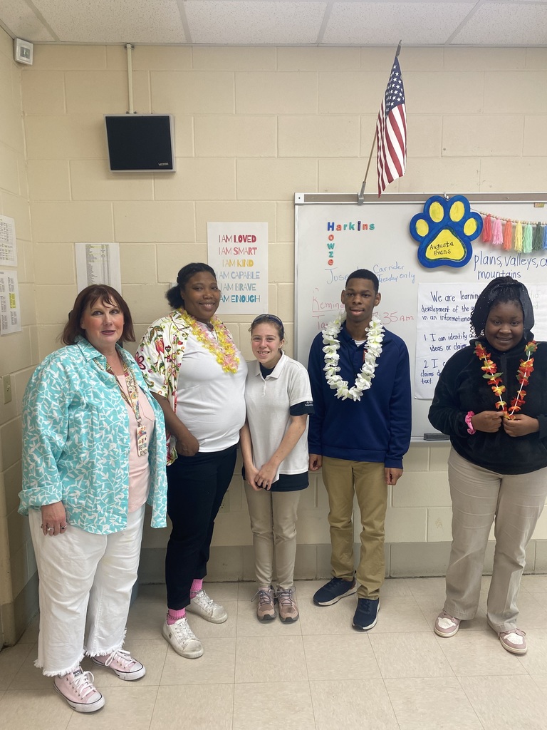 Class photo with teacher and para 