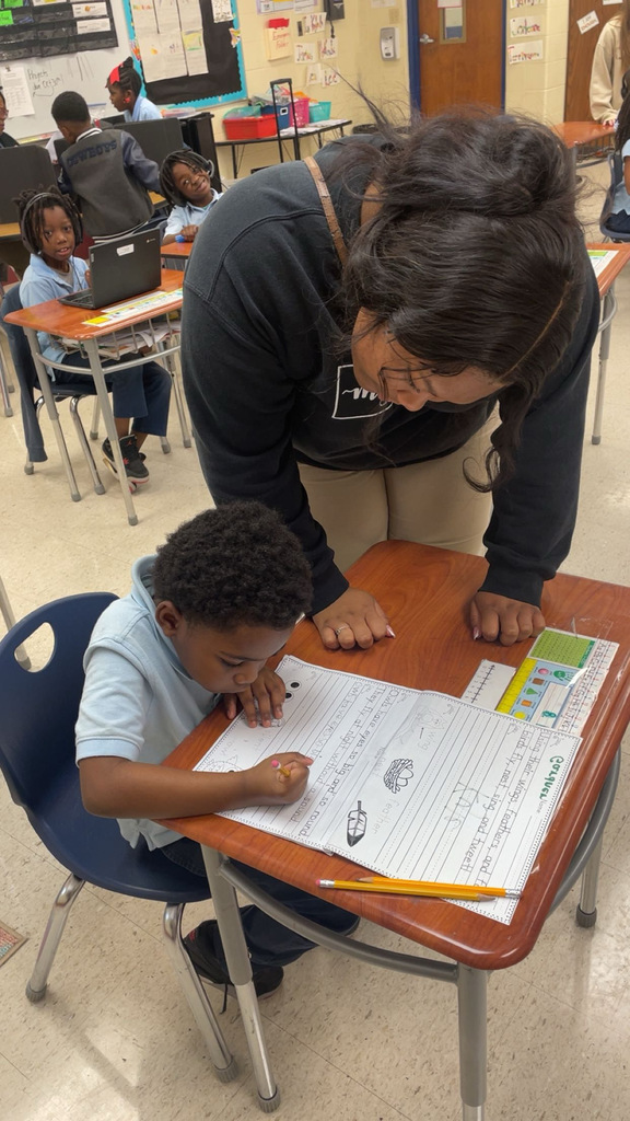 Faulkner student volunteering at Ella Grant Elementary.
