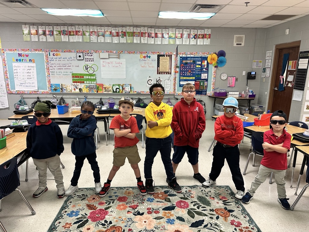 students wearing caps and glasses