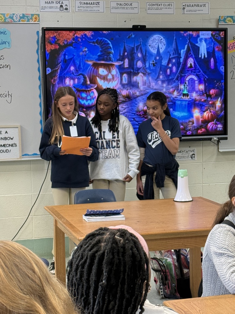 Students standing in front of the class