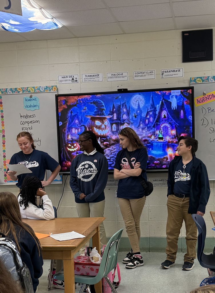 Students standing in front of the class
