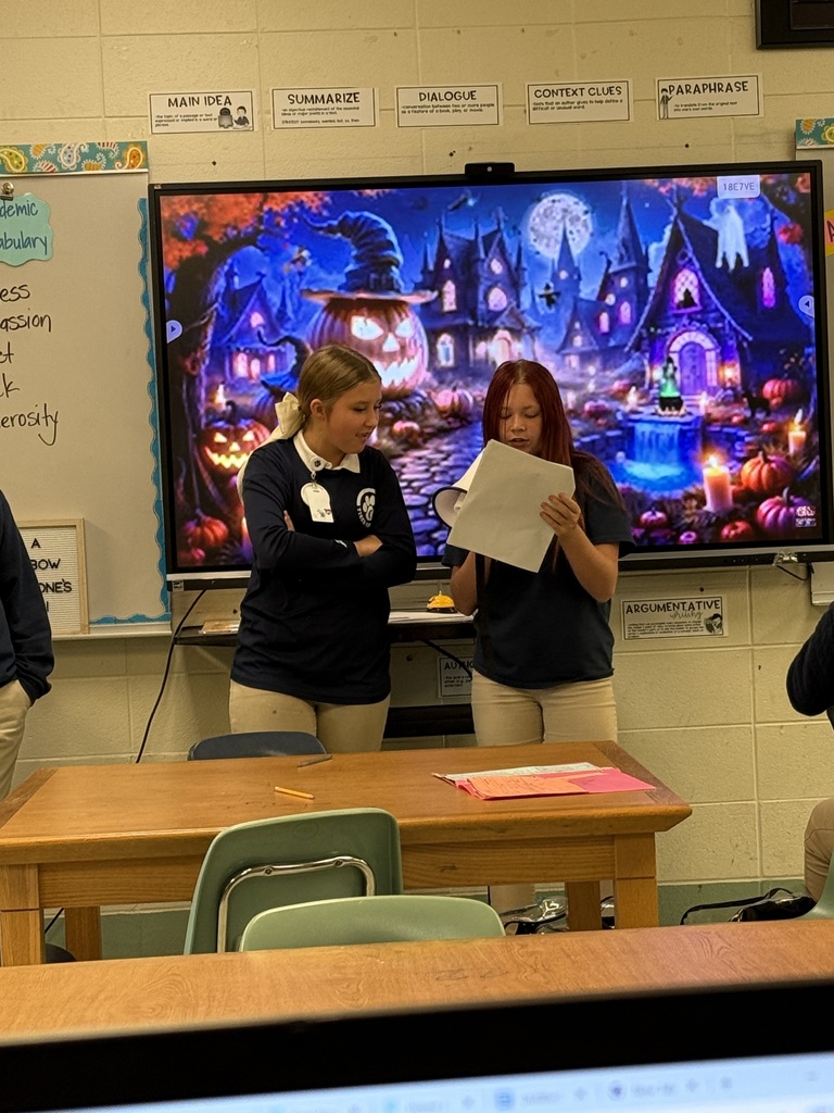 Students standing in front of class