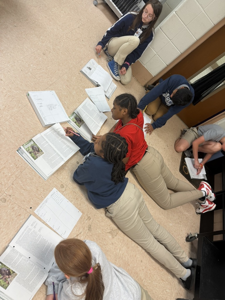 Group of students working together on the floor
