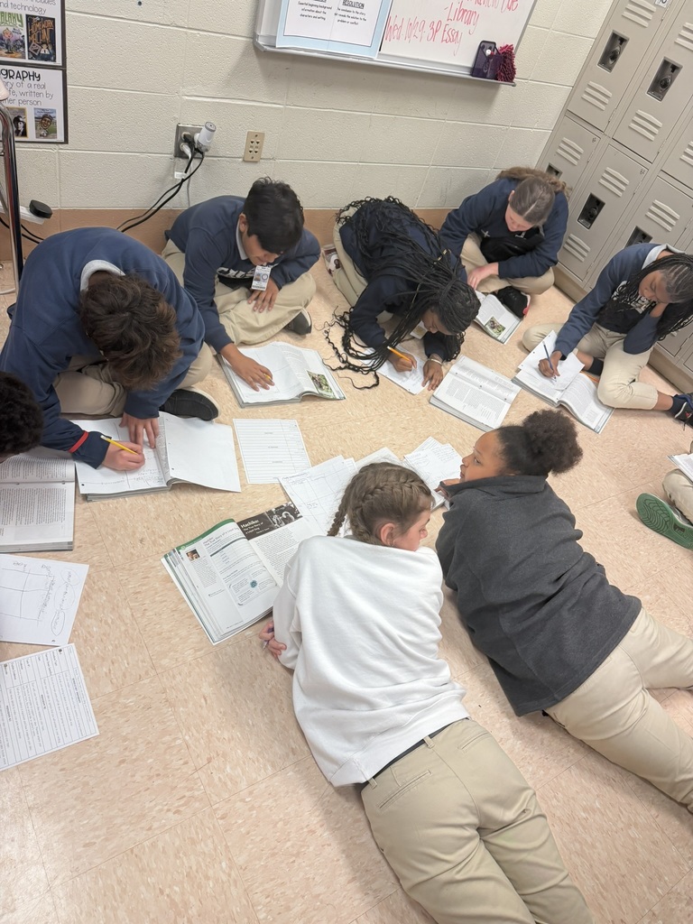 Group of students working together on the floor