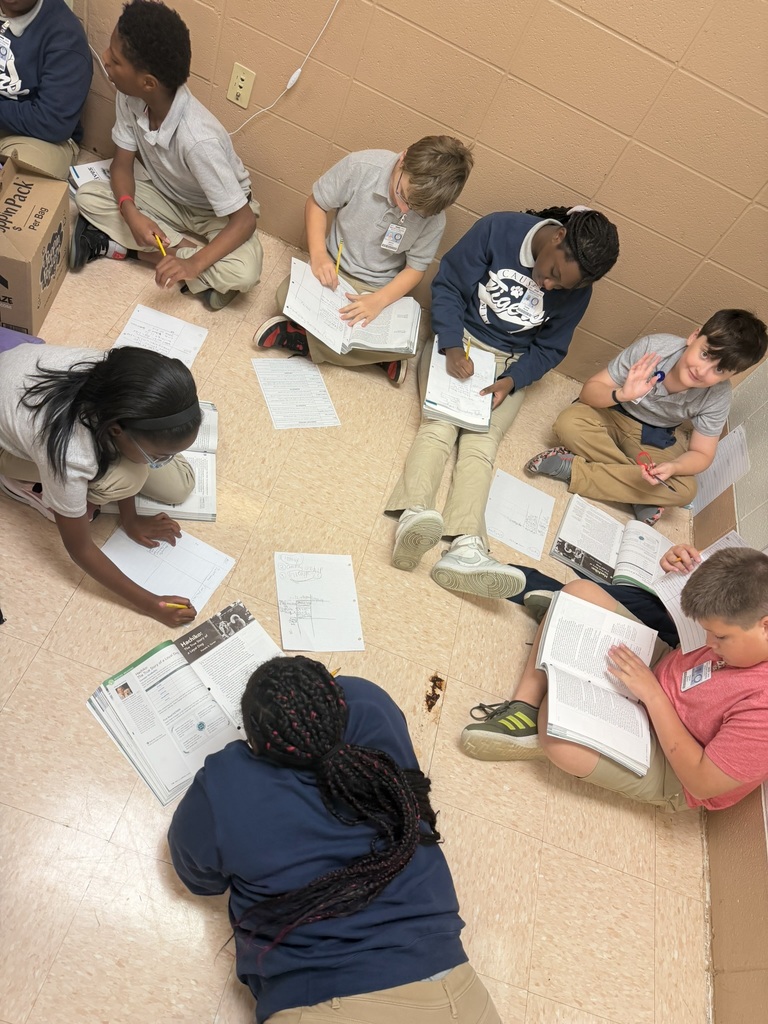 Group of students working together on the floor