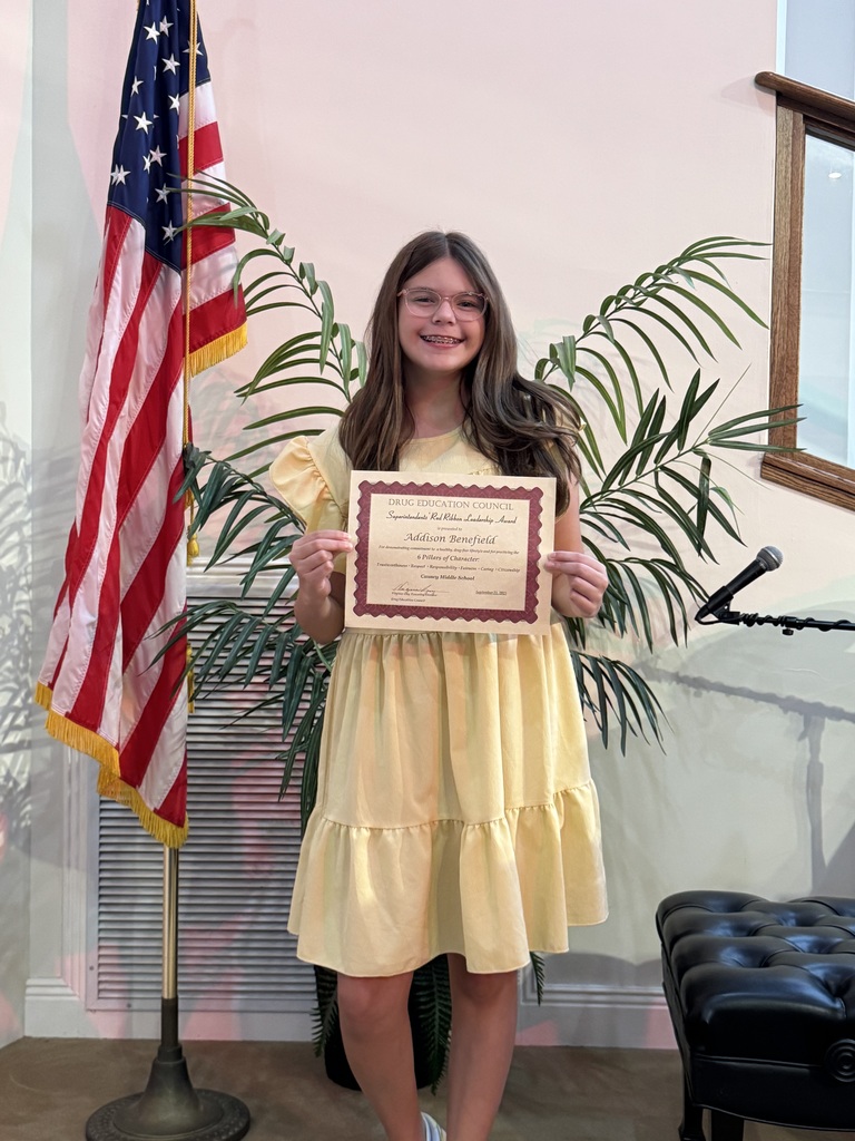 Addison Benefield holding a certificate