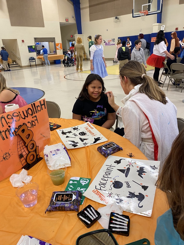 Student getting her face painted 