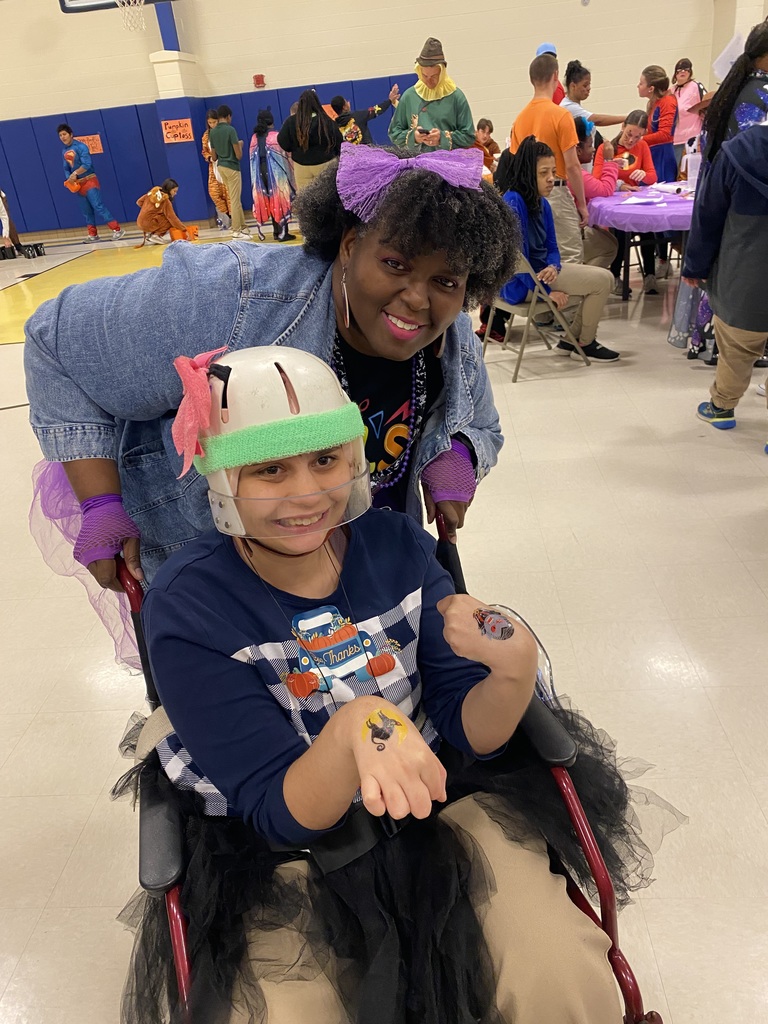 Mrs. Ross with student 