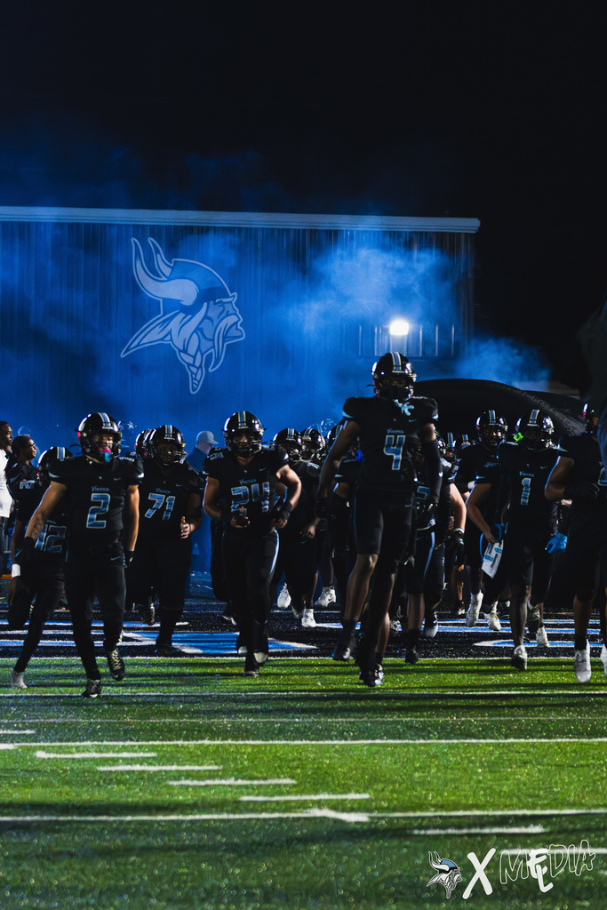 MGM Football players running on the field