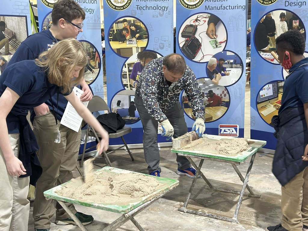 Masonry Instructor doing a demo for Middle School students