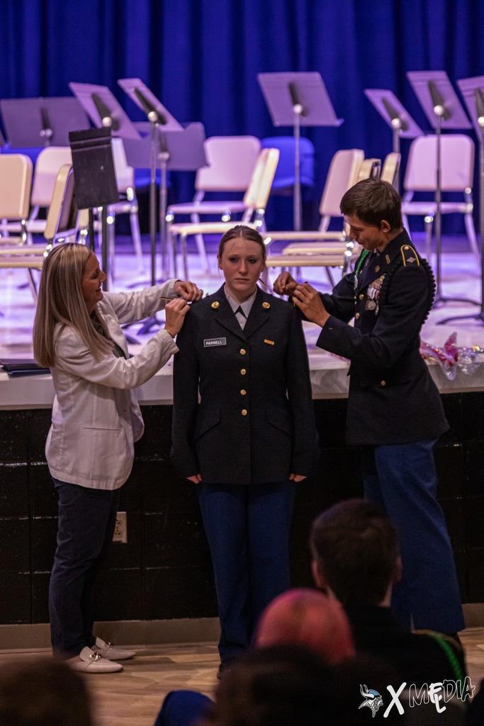 Cadets received their new cords and pins with the help of Assistant Principal, Ms. Box.