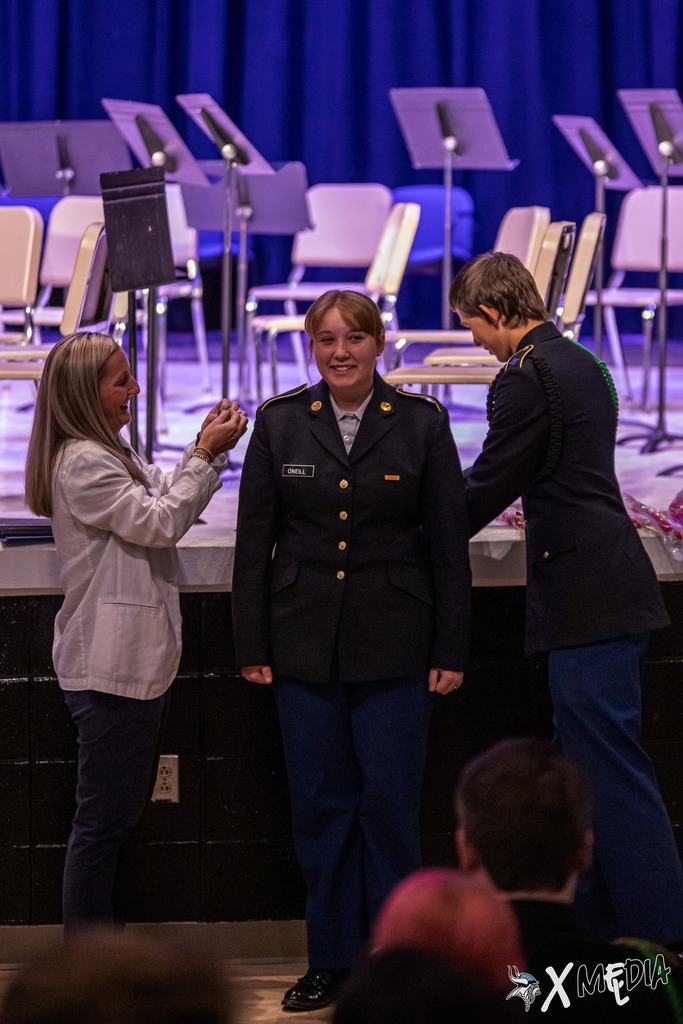 Cadets received their new cords and pins with the help of Assistant Principal, Ms. Box.