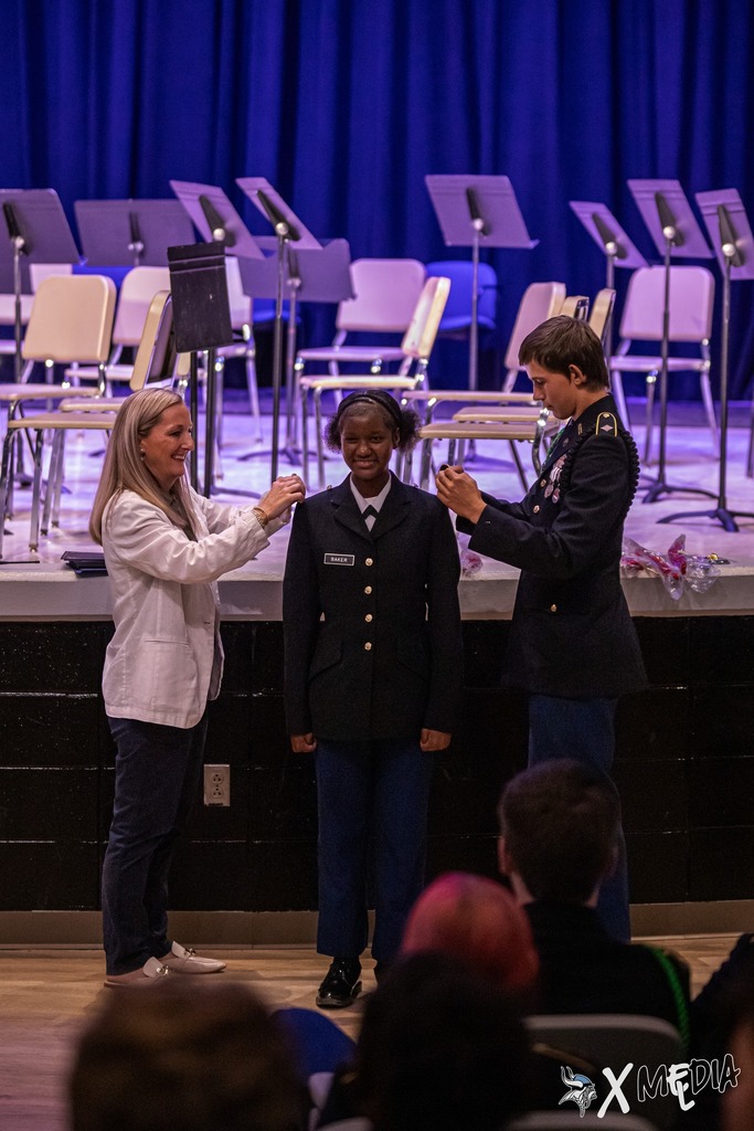 Cadets received their new cords and pins with the help of Assistant Principal, Ms. Box.