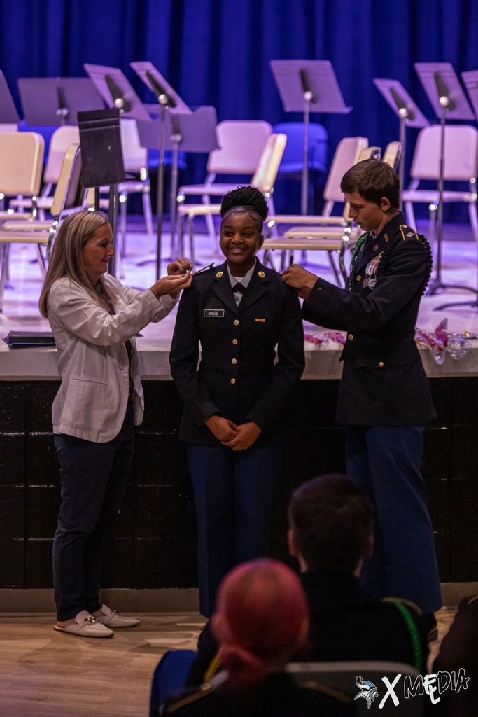 Cadets received their new cords and pins with the help of Assistant Principal, Ms. Box.