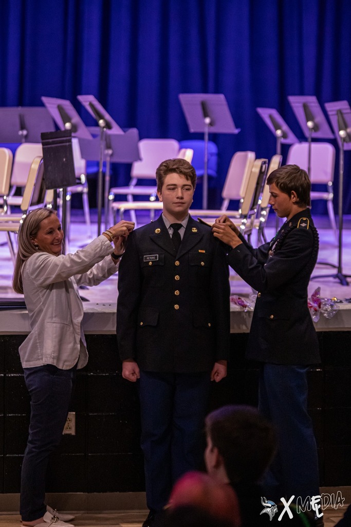 Cadets received their new cords and pins with the help of Assistant Principal, Ms. Box.