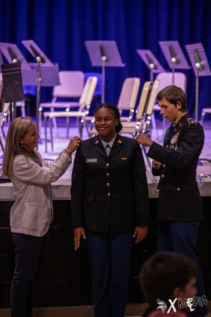 Cadets received their new cords and pins with the help of Assistant Principal, Ms. Box.