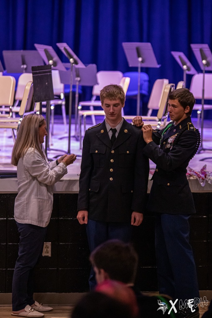 Cadets received their new cords and pins with the help of Assistant Principal, Ms. Box.