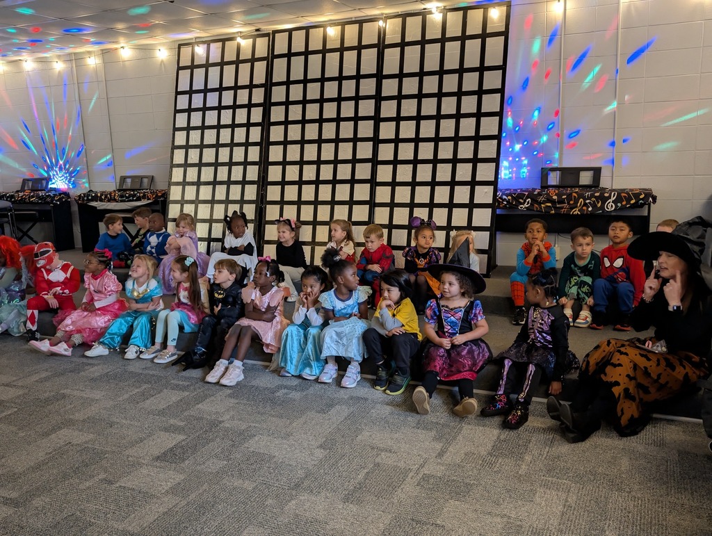 Pre-K students listening to a story