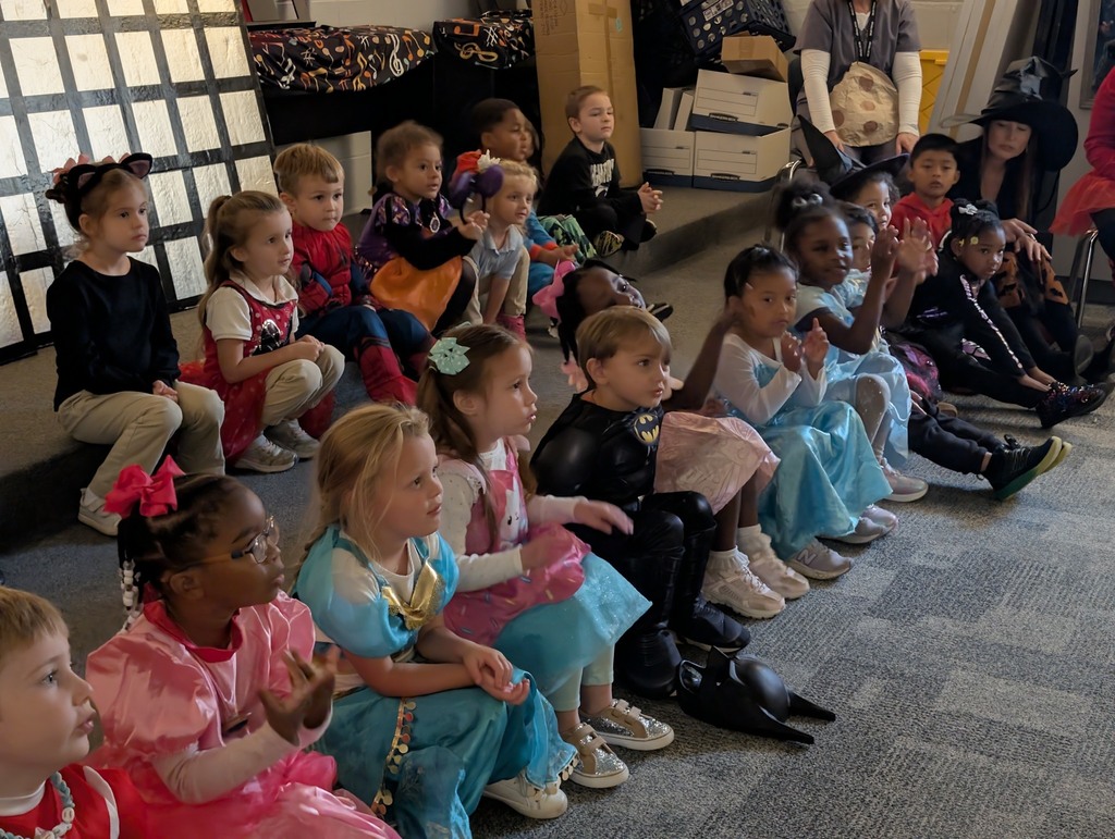 Pre-K students listening to a story