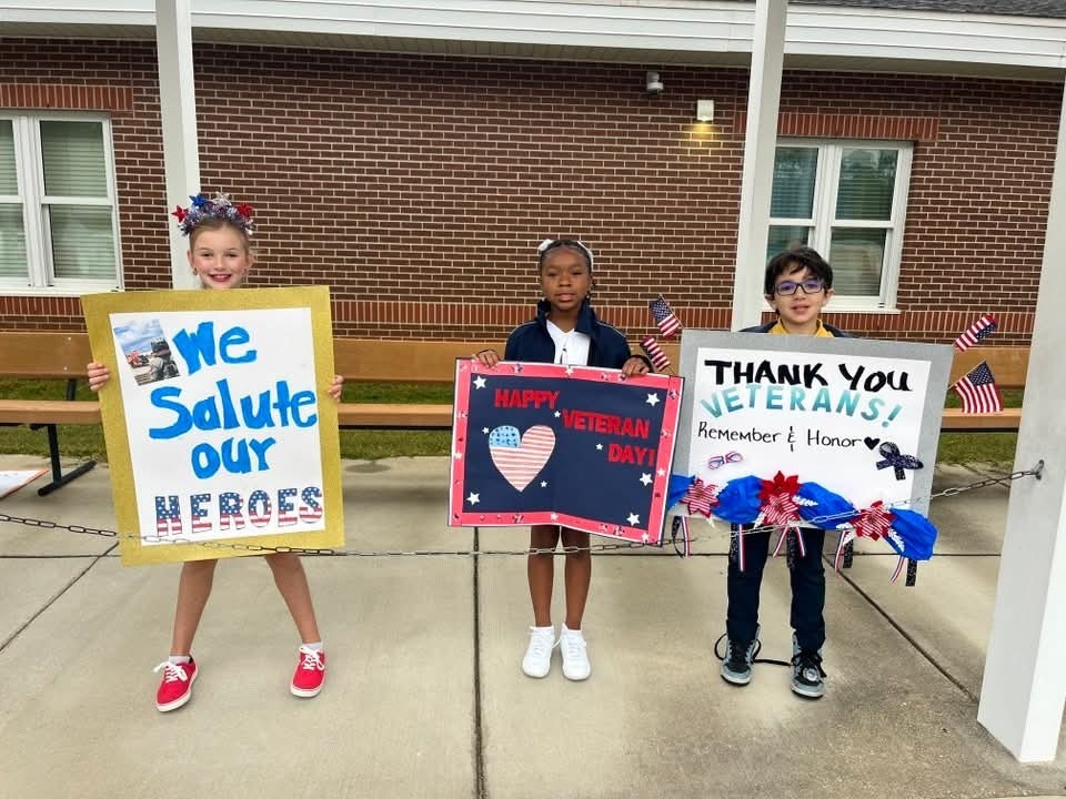 Taylor-White students with signs