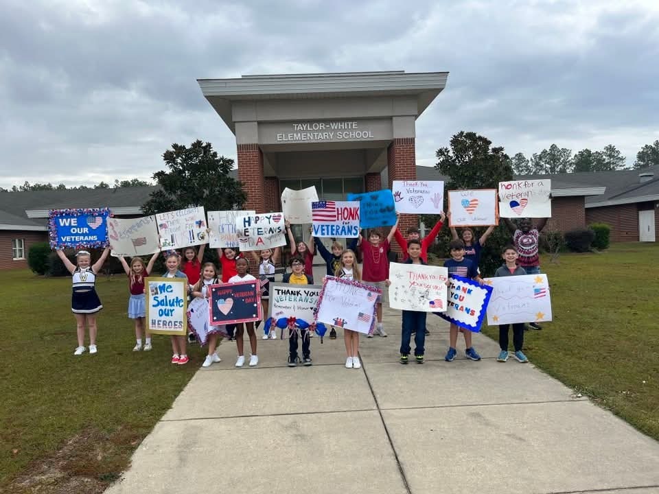 Taylor-White students with signs