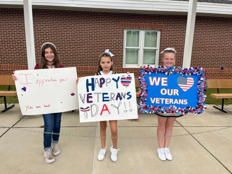 Taylor-White students with signs