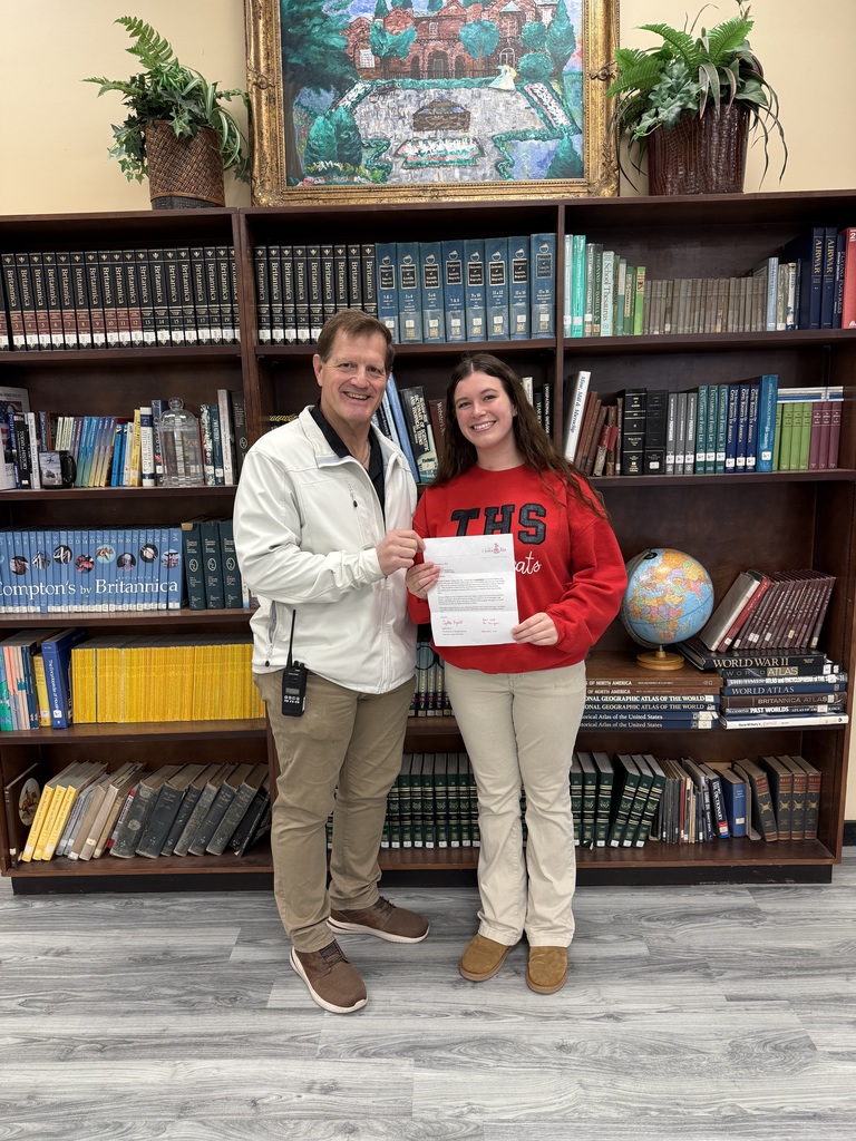 Dr. Maxwell congratulates Paisley Cox on being selected an Azalea Trail Maid!