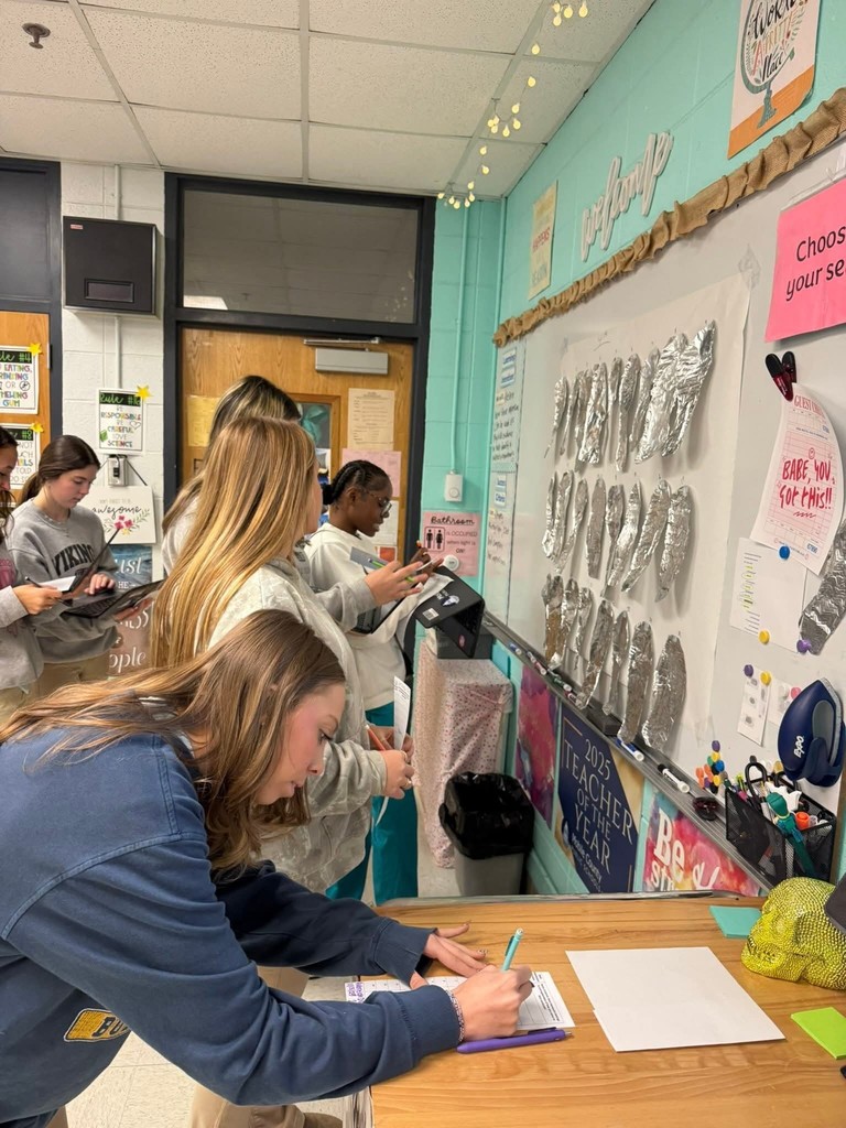 Students analyzing impressions from other classes