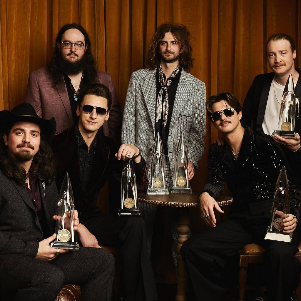 A group photo of the Red Clay Strays, with their CMA awards