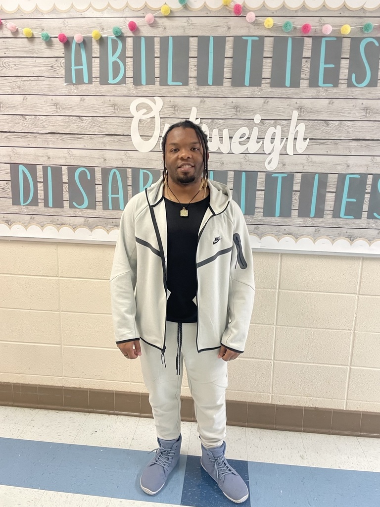 Teacher standing in the hallway