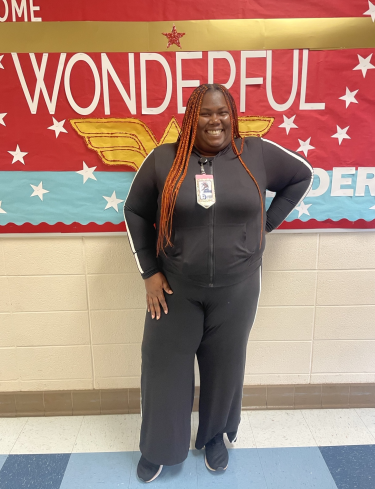 Teacher standing in the hallway