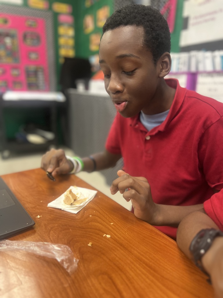 Ms. Colston's Class discussing a Thanksgiving passage and eating pumpkin pie. 