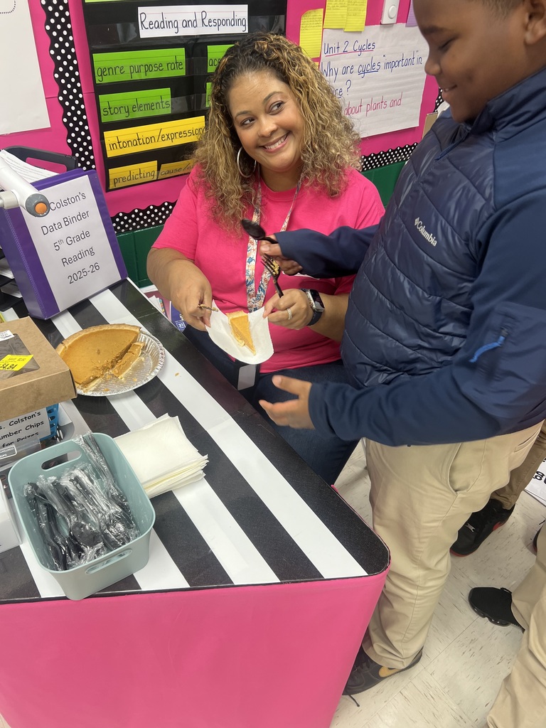 Ms. Colston's Class discussing a Thanksgiving passage and eating pumpkin pie. 