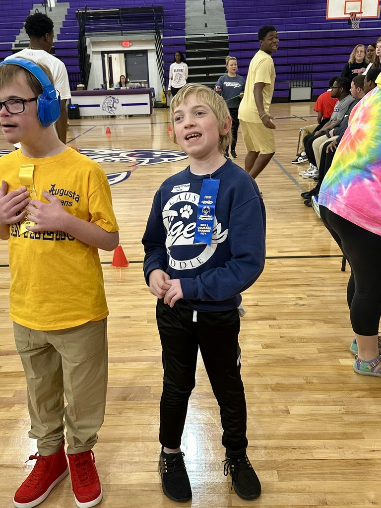 Student standing with ribbon on shirt