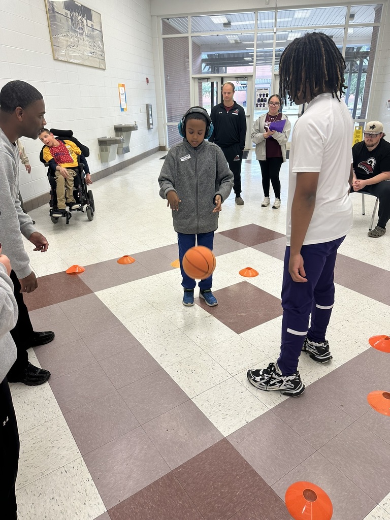 Student playing with a basketball