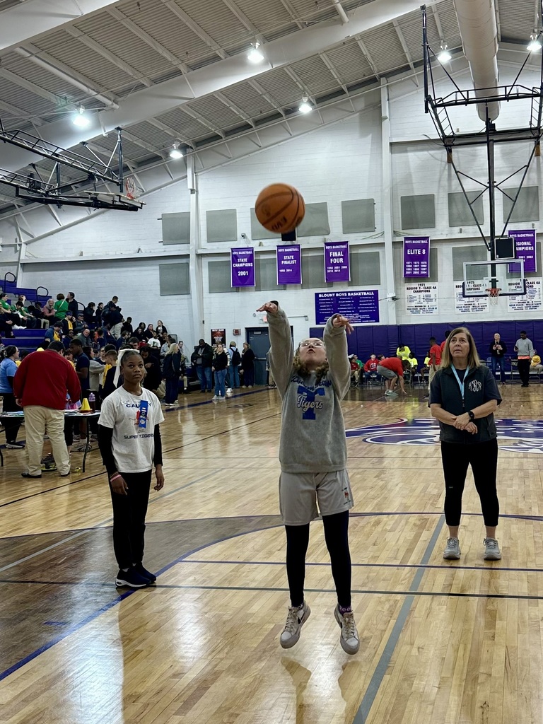 Student shooting a basketball