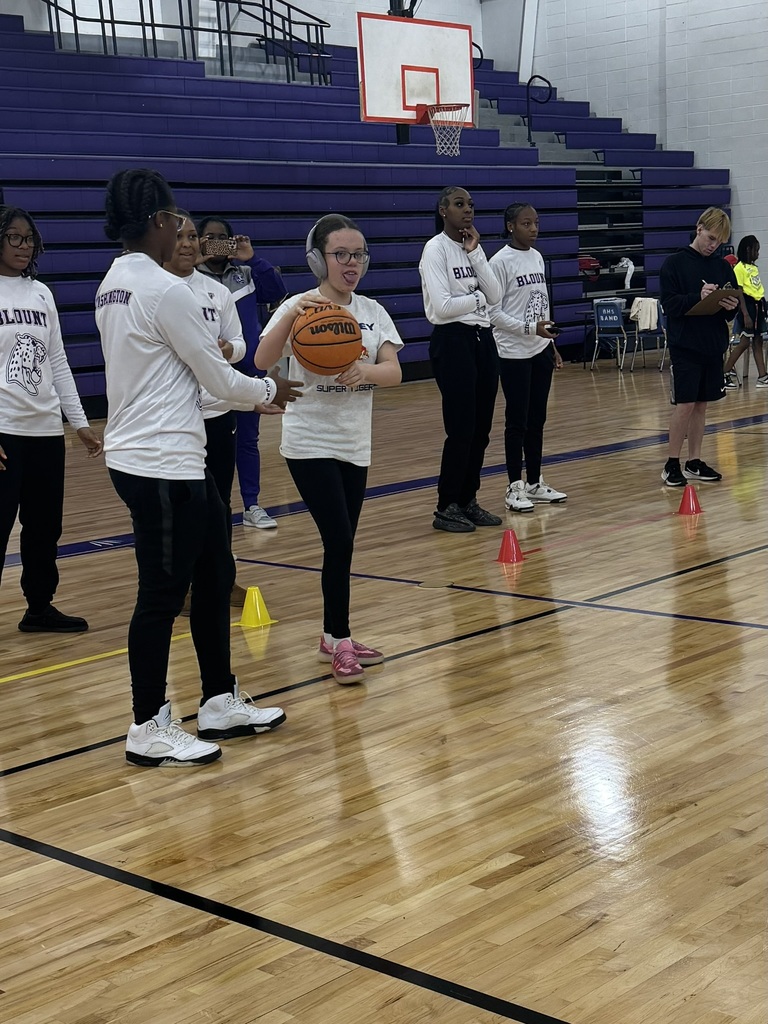 Student playing with a basketball