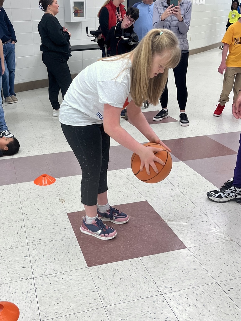 Student playing with a basketball