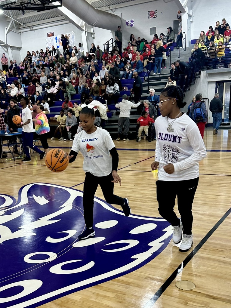 Student dribbling a basketball
