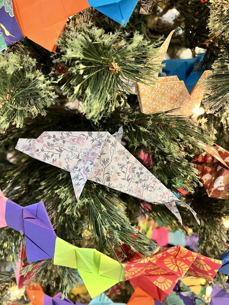 whale origami on tree