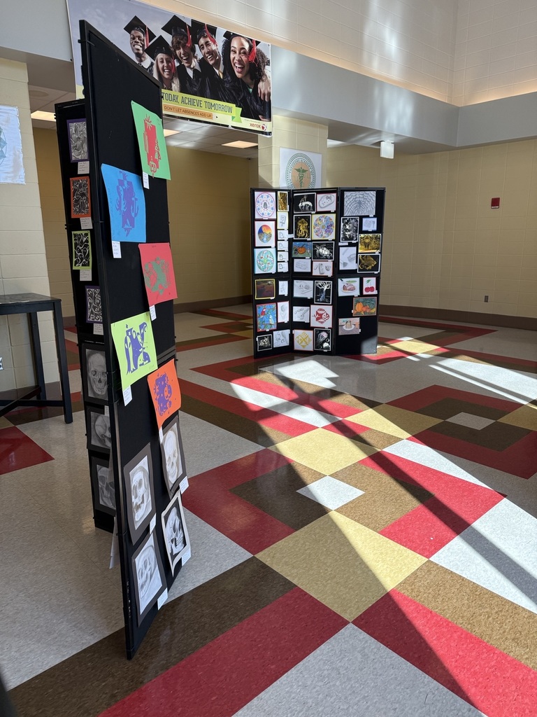 Art students display their work at the Fine Arts Christmas program. 